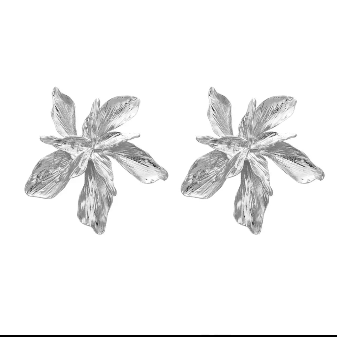 Fina Bold Metallic leaf earrings .